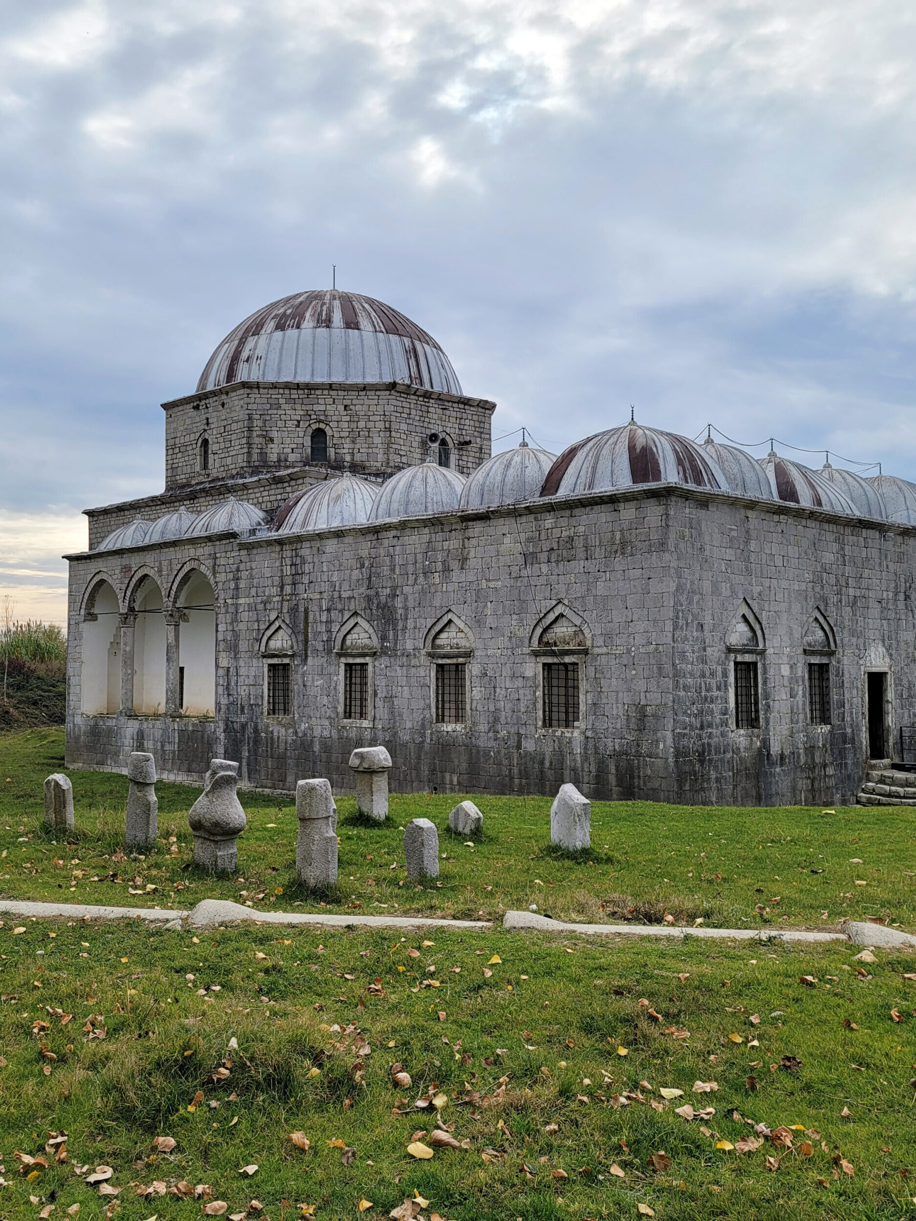 The Lead Mosque, featuring a grand central dome and historic stone walls