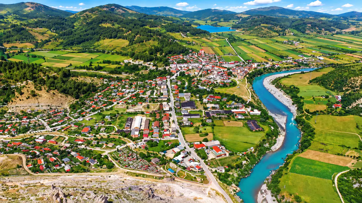 Accommodation in Permet, Albania, surrounded by mountain scenery
