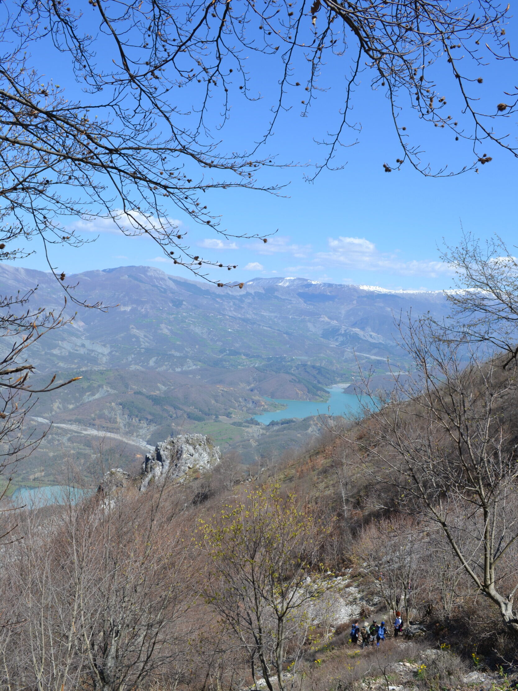 Hiking view over Lake Bovilla from Mount Gamti