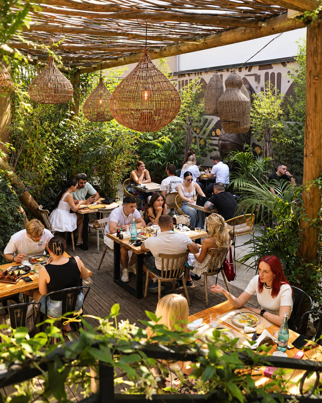 Outdoor brunch atmosphere at Folium Gathering Place in Tirana