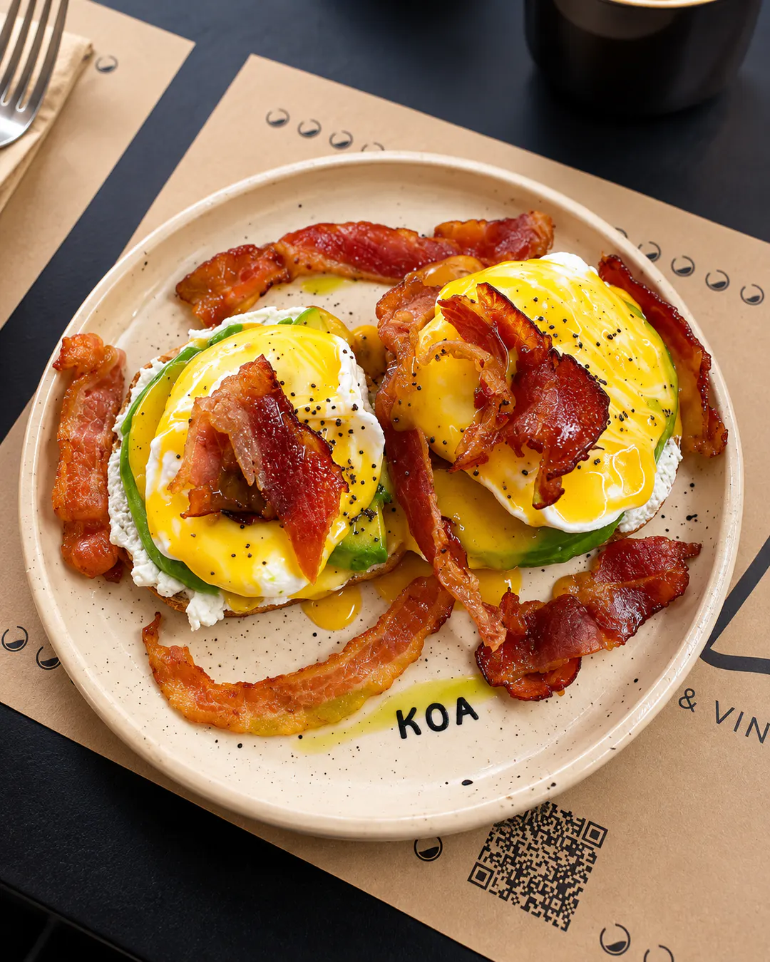 Eggs Benedict with bacon and avocado at KOA Brunch & Vino in Tirana