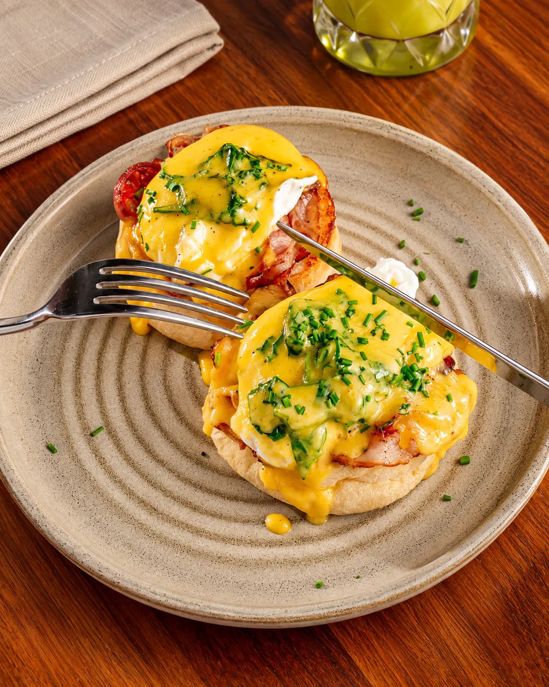 Eggs Benedict with bacon and hollandaise sauce at MUGO in Blloku, Tirana