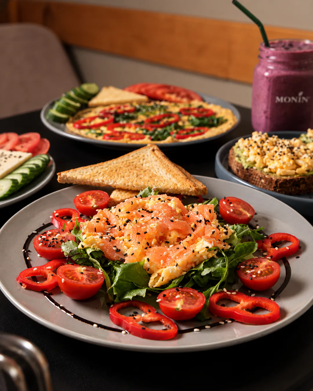 Eggs with smoked salmon, greens and tomatoes for breakfast at Savory in Tirana