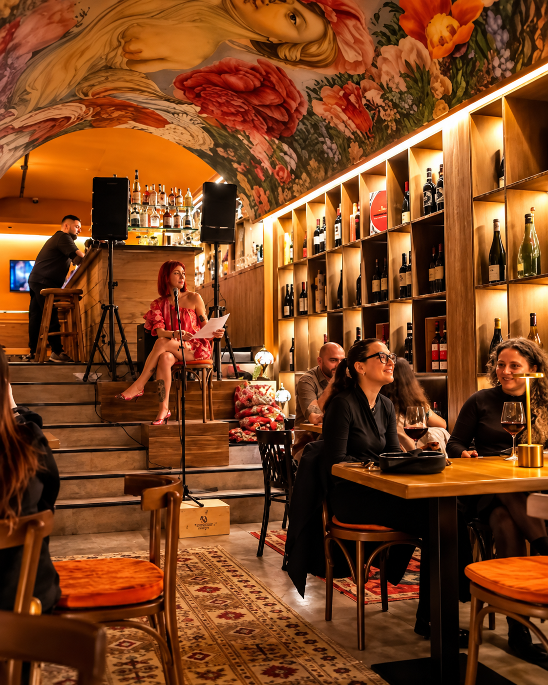 Interior of SÒRSO Wine Bar & Kitchen in Tirana with wine shelves and guests