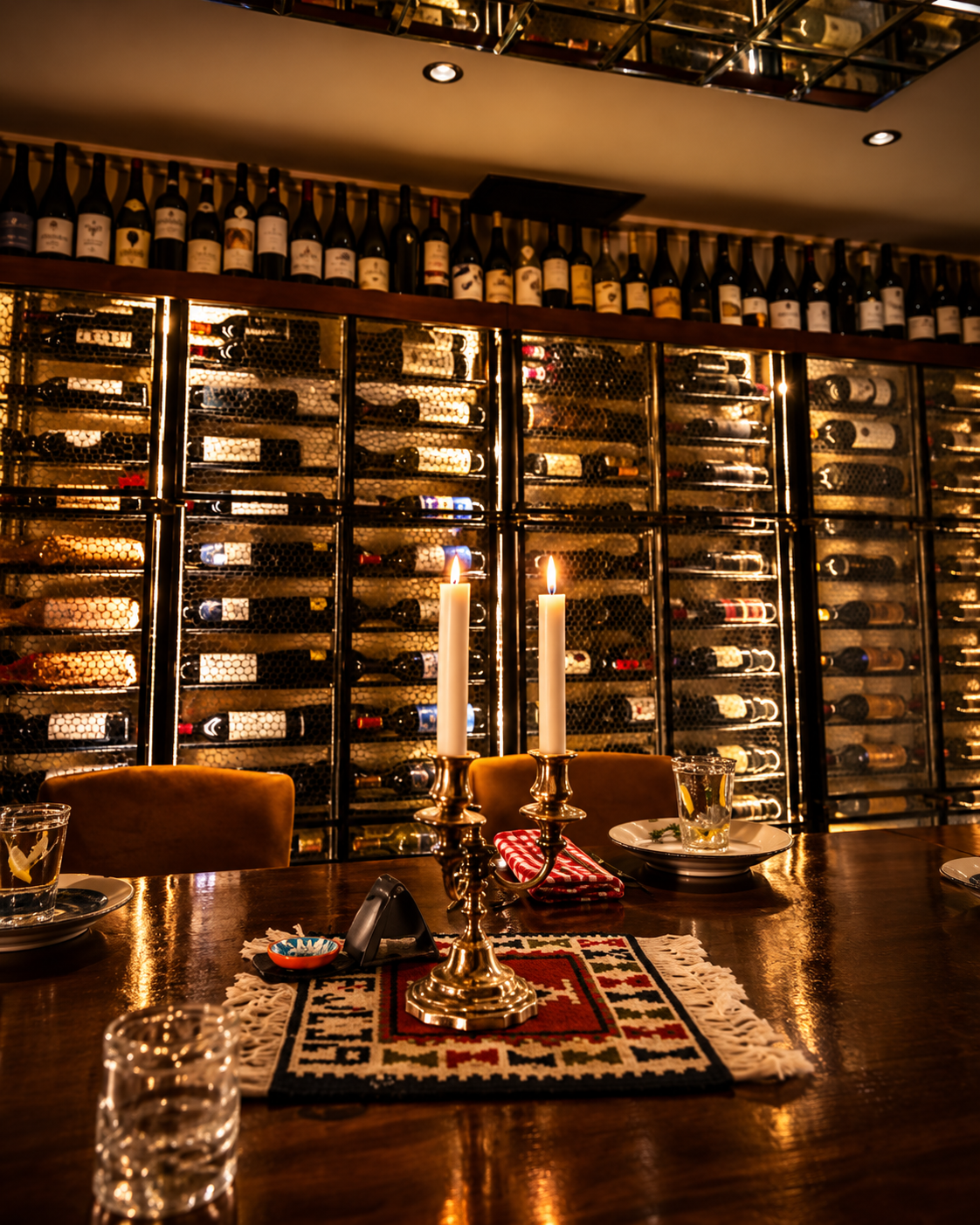 Interior of VENA Wine Bar in Tirana with an extensive wine collection and candlelit table