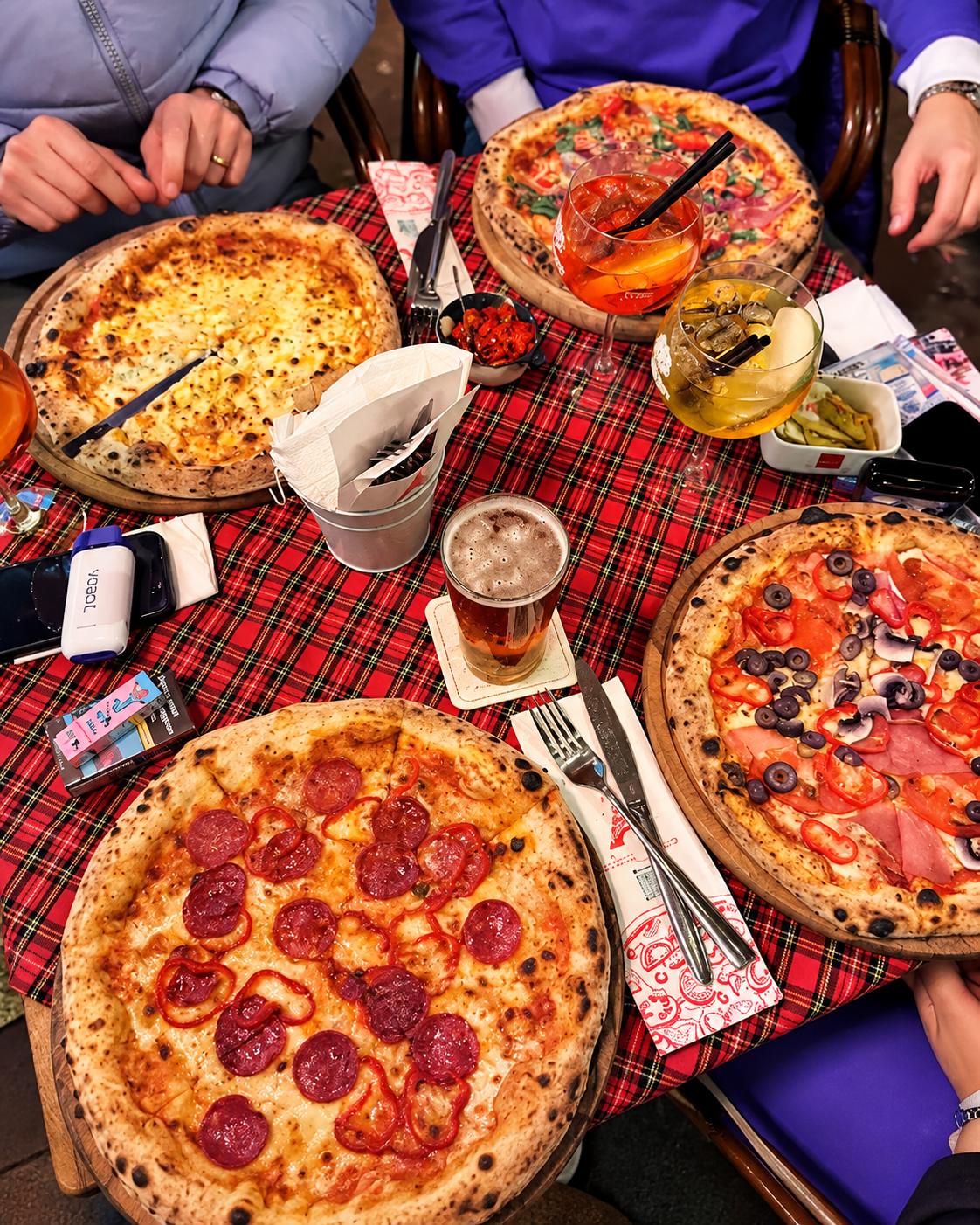 Group dining with pizzas at Pizza Paris in Tirana