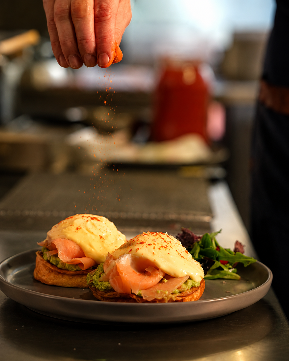 Eggs Benedict being prepared for brunch at Delibros Tirana