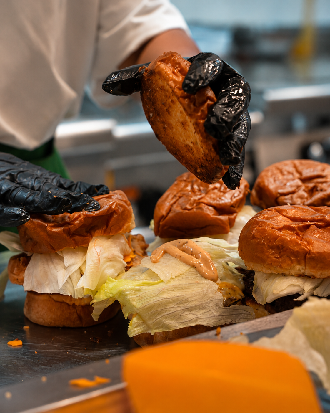 Delibros burgers being freshly prepared in the kitchen