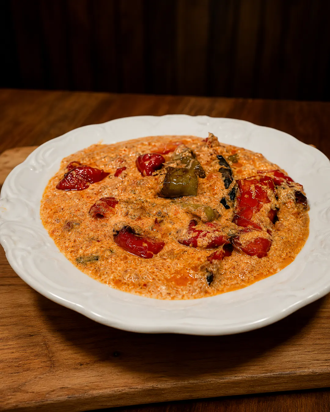 Traditional Tirana fërgesë with peppers and gjizë