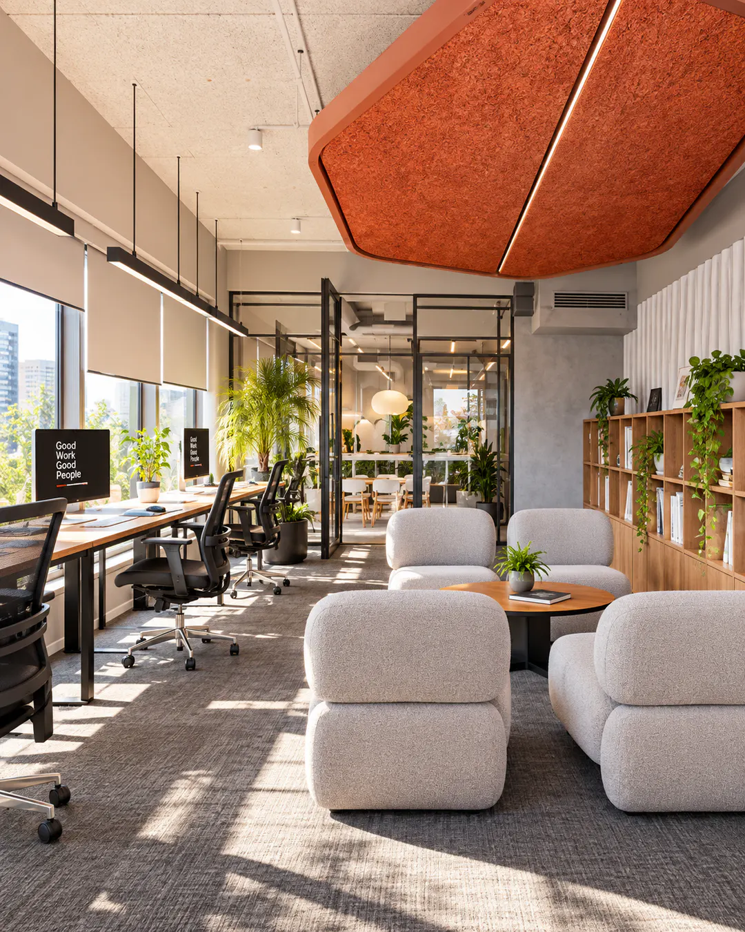 Moderno spazio di coworking open space con scrivanie e area lounge presso n'Zon a Tirana