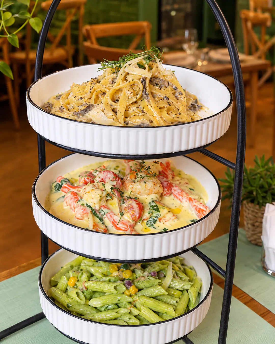 Pasta Tris with three pasta dishes at Omai Restaurant in Blloku, Tirana