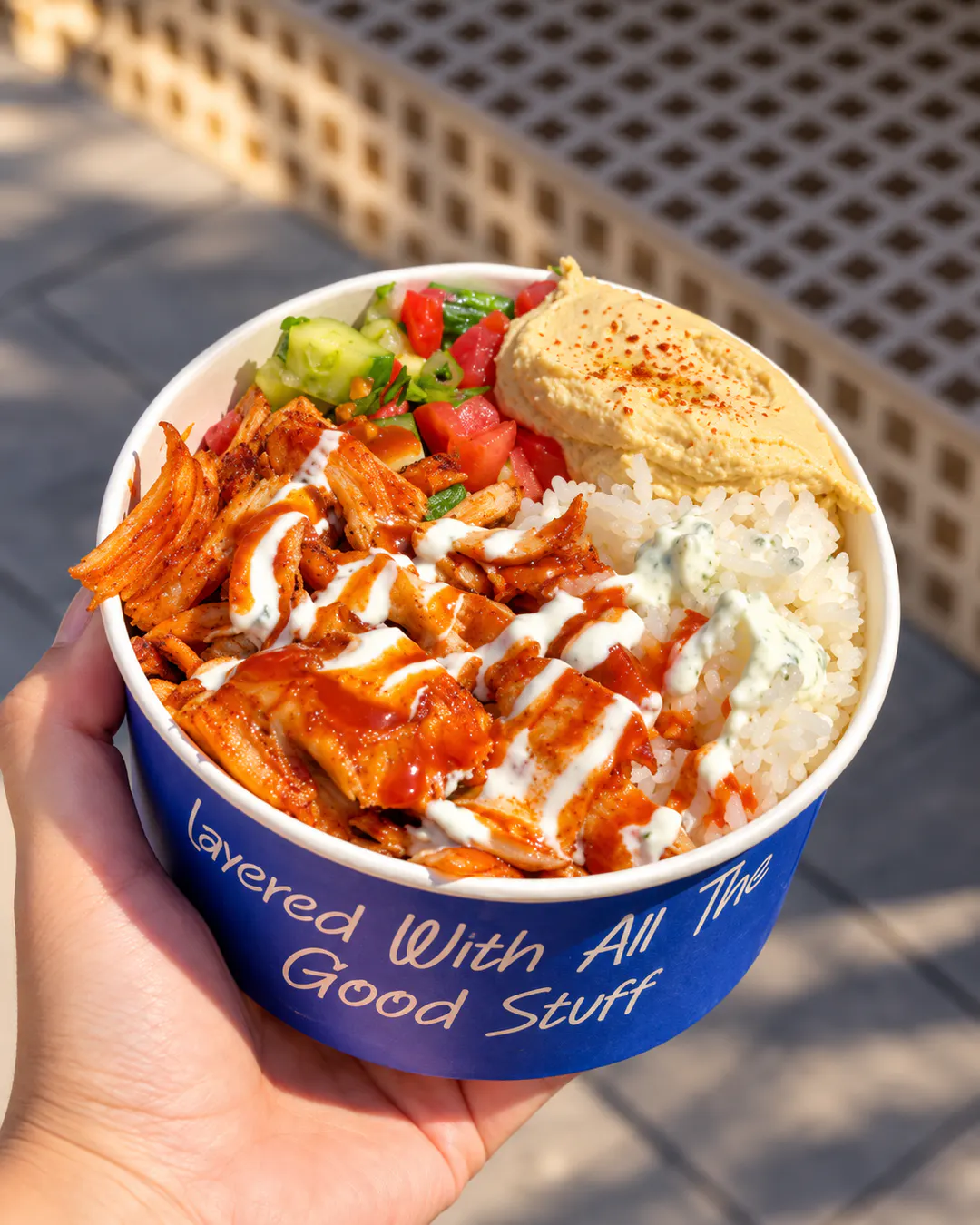 Kebab bowl with chicken, rice, hummus and salad at Raiha Kebab & Cocktails in Tirana