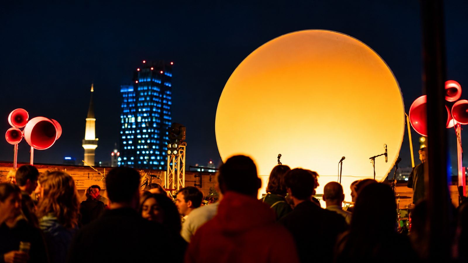 Tunel Music Venue in Tirana with an outdoor electronic music event, stage lighting and nighttime crowd