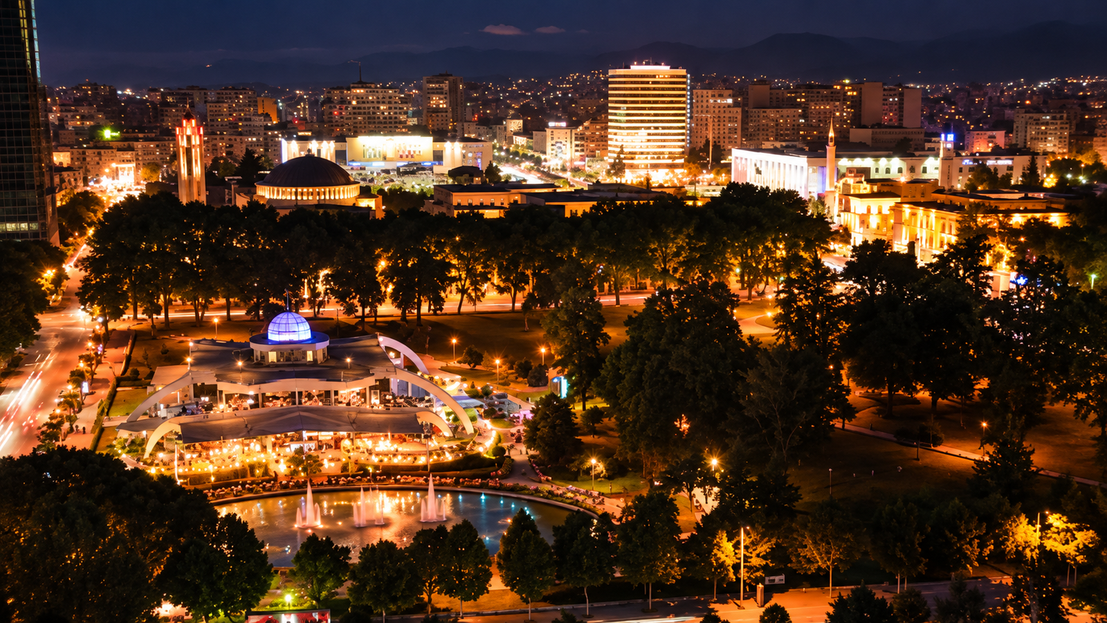 Panoramic night view of Tirana city lights near Blloku, one of the most popular nightlife districts in Albania.