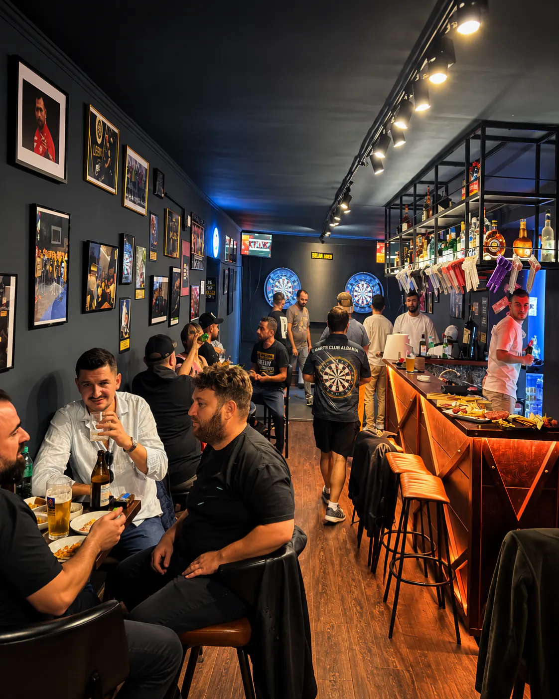 Interior of Darts Club Tirona with dartboards and sports bar area