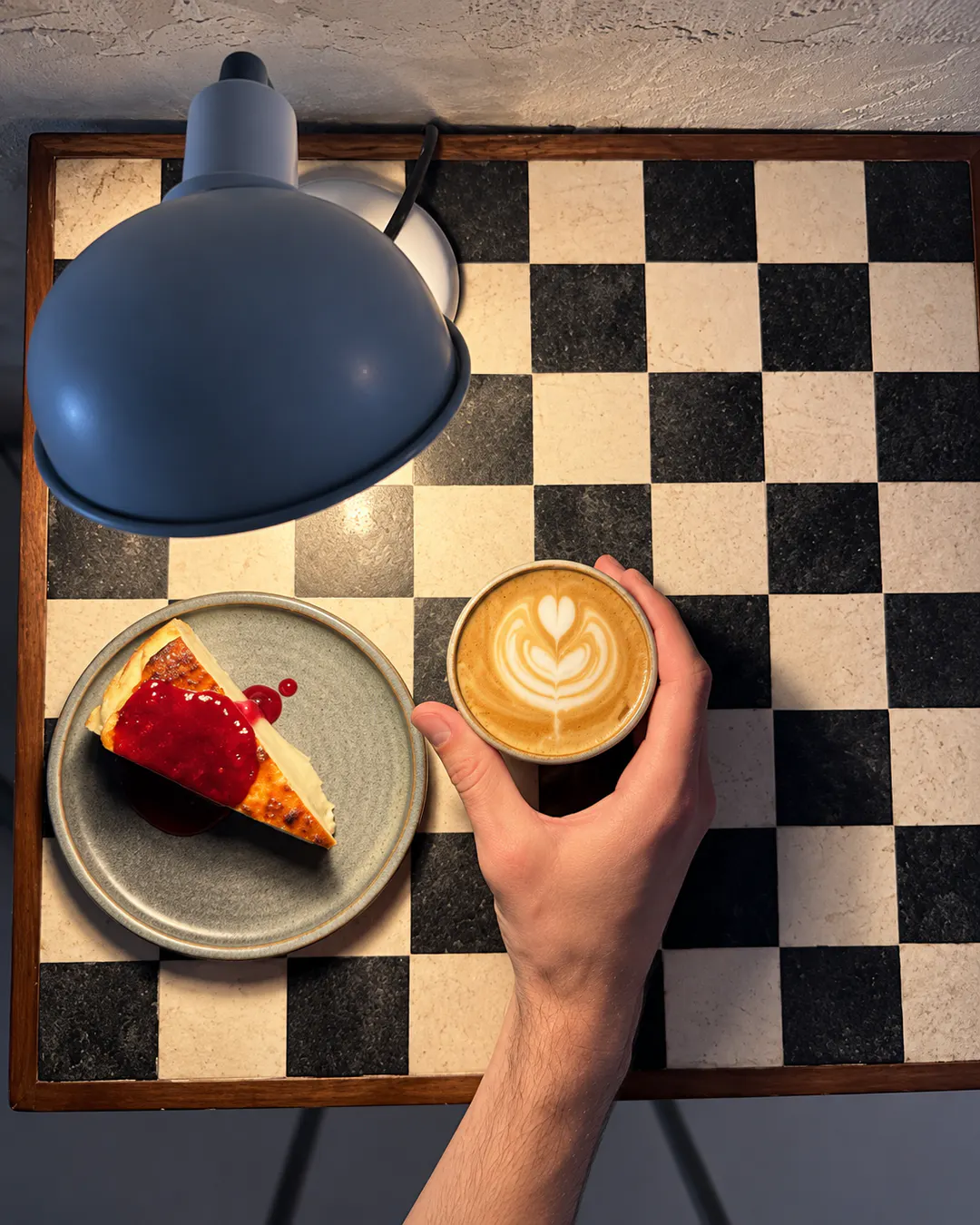 Specialty coffee with latte art and dessert at The Back Room in Tirana