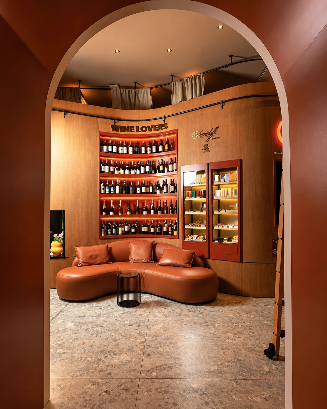 Elegant wine lounge interior with arched architectural details at ZABÒ Garden in Tirana.