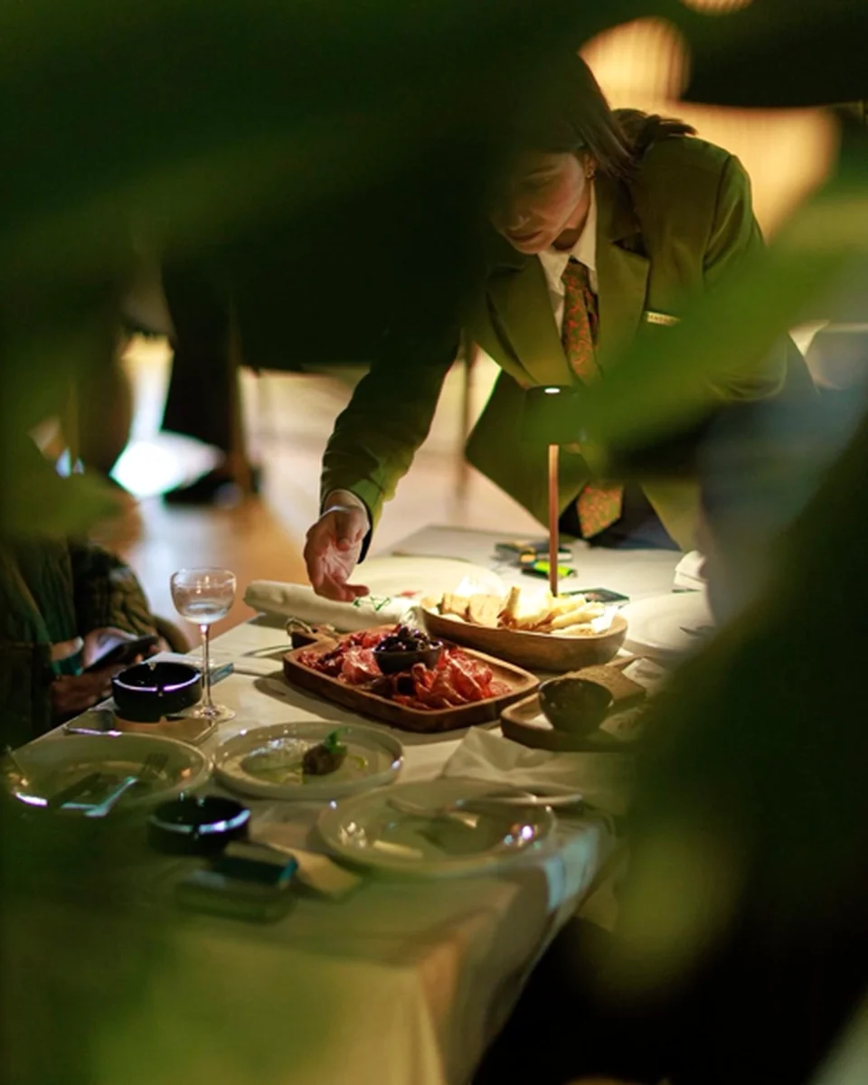 Table service with a charcuterie selection at ZABÒ Garden restaurant in Tirana.