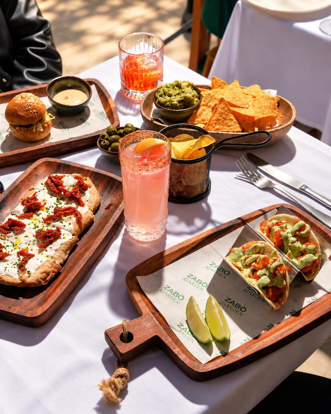 Tacos, nachos, and cocktails served at ZABÒ Garden restaurant in Tirana.
